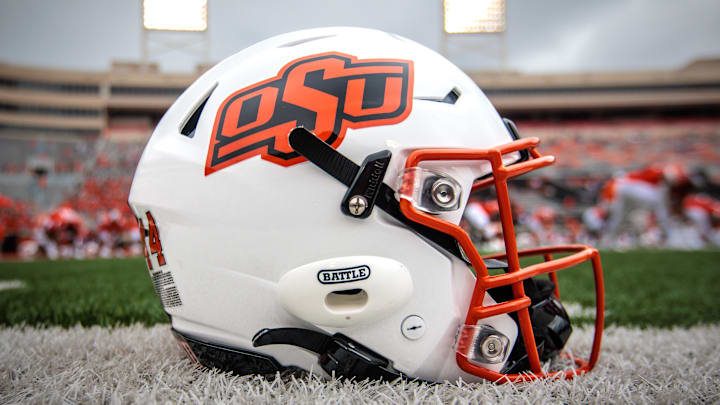 Aug 31, 2024; Stillwater, Oklahoma, USA; Oklahoma State Cowboys helmet sits on the field prior to the game against the South Dakota State Jackrabbits at Boone Pickens Stadium. Mandatory Credit: William Purnell-Imagn Images