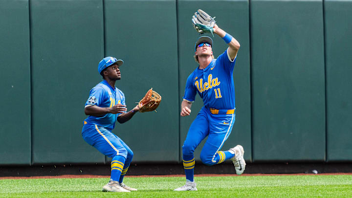 Jun 14, 2025; Omaha, Neb, USA; UCLA Bruins center fielder Payton Brennan (11) catches for an out against the Murray State Racers during the sixth inning at Charles Schwab Field. Mandatory Credit: Dylan Widger-Imagn Images Jun 14, 2025; Omaha, Neb, USA; UCLA Bruins center fielder Payton Brennan (11) catches for an out against the Murray State Racers during the sixth inning at Charles Schwab Field. Mandatory Credit: Dylan Widger-Imagn Images