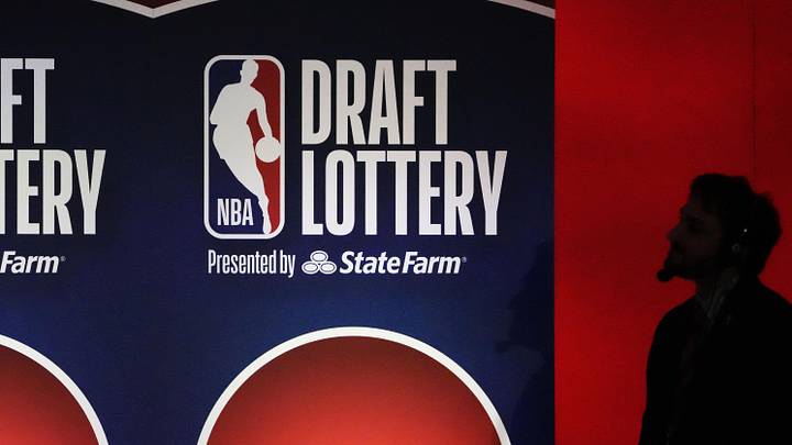 May 12, 2025; Chicago, Illinois, US; A person watches the 2025 NBA Draft Lottery at McCormick Place. Mandatory Credit: David Banks-Imagn Images