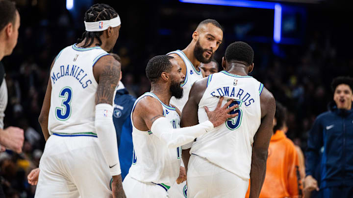 Mar 7, 2024; Indianapolis, Indiana, USA; Minnesota Timberwolves guard Mike Conley (10) and guard Anthony Edwards (5) celebrate the win over Indiana Pacers at Gainbridge Fieldhouse. Mandatory Credit: Trevor Ruszkowski-Imagn Images