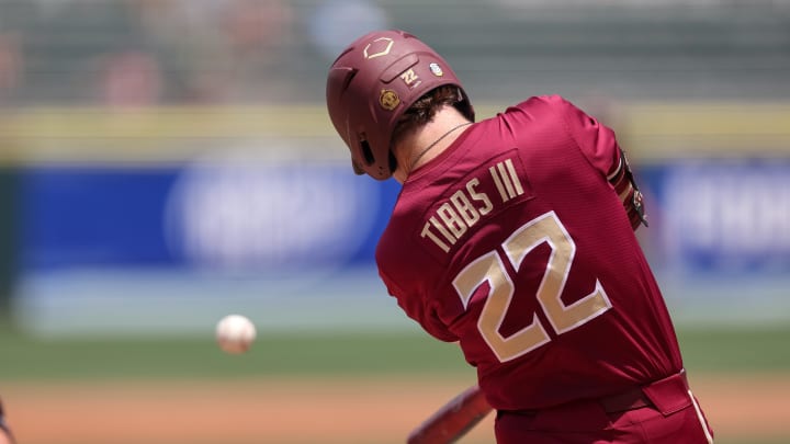 May 25, 2024; Charlotte, NC, USA; Florida State outfielder James Tibbs III (22) hits a ball in the second inning against Wake Forest during the ACC Baseball Tournament at Truist Field. 