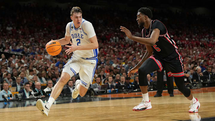 Apr 5, 2025; San Antonio, TX, USA; Duke Blue Devils forward Cooper Flagg (2) dribbles the ball against Houston Cougars forward Ja'Vier Francis (5) during the second half in the semifinals of the men's Final Four of the 2025 NCAA Tournament at the Alamodome. Mandatory Credit: Bob Donnan-Imagn Images