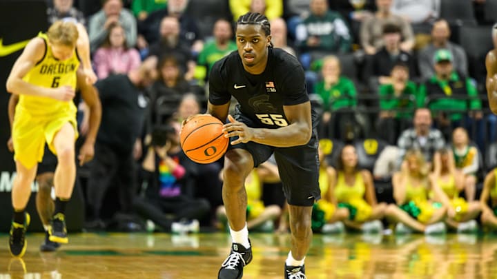 Jan 20, 2026; Eugene, Oregon, USA; Michigan State Spartans forward Coen Carr (55) brings the ball up court during the second half against the Oregon Ducks at Matthew Knight Arena. Mandatory Credit: Craig Strobeck-Imagn Images
