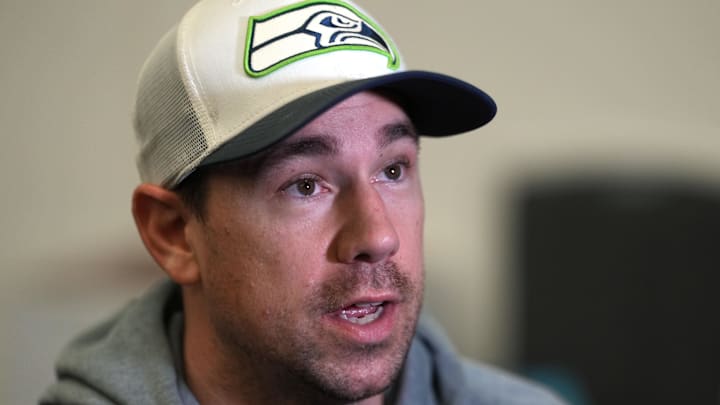 Seattle Seahawks offensive coordinator Klint Kubiak talks to media members