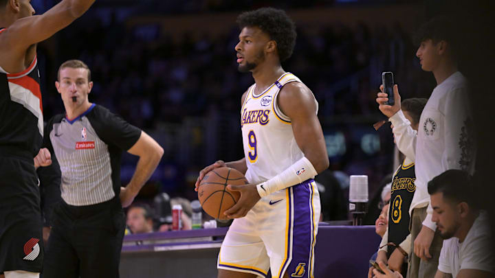 Dec 8, 2024; Los Angeles, California, USA;  Los Angeles Lakers guard Bronny James (9) looks to inbound the ball in the second half against the Portland Trail Blazers at Crypto.com Arena. Mandatory Credit: Jayne Kamin-Oncea-Imagn Images
