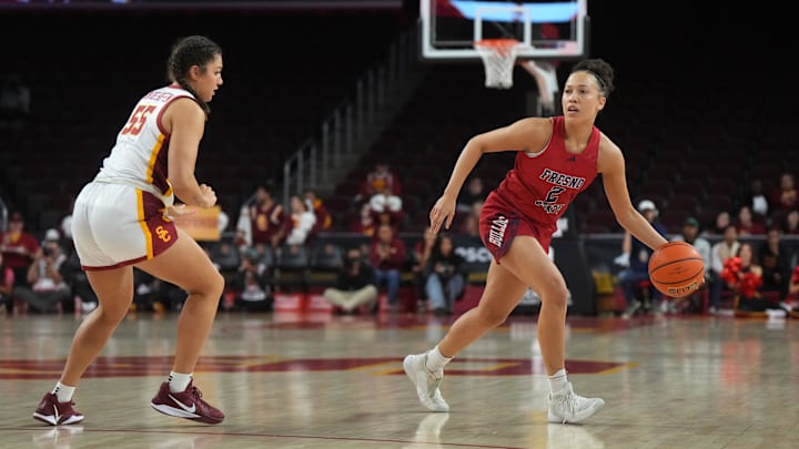 Fresno State Bulldogs guard Mariah Elohim (2) dribbles the ball against Southern California Trojans guard Talia von Oelhoffen (55) in the first half at Galen Center. USC defeated Fresno State 89-40. Fresno State Bulldogs guard Mariah Elohim (2) dribbles the ball against Southern California Trojans guard Talia von Oelhoffen (55) in the first half at Galen Center. USC defeated Fresno State 89-40.
