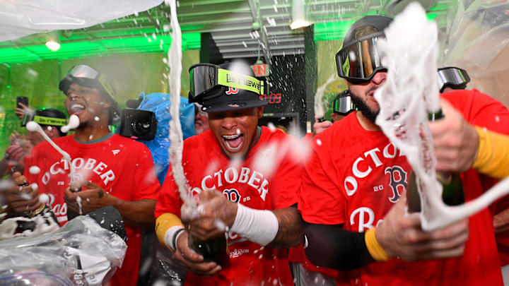 Sep 26, 2025; Boston, Massachusetts, USA; Boston Red Sox center fielder Ceddanne Rafaela (center) celebrates clinching a playoff spot with teammates after their game against the Detroit Tigers at Fenway Park. Mandatory Credit: Eric Canha-Imagn Images