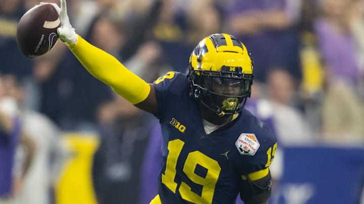 Dec 31, 2022; Glendale, Arizona, USA; Michigan Wolverines defensive back Rod Moore (19) celebrates an interception against the TCU Horned Frogs during the 2022 Fiesta Bowl at State Farm Stadium. Mandatory Credit: Mark J. Rebilas-Imagn Images Dec 31, 2022; Glendale, Arizona, USA; Michigan Wolverines defensive back Rod Moore (19) celebrates an interception against the TCU Horned Frogs during the 2022 Fiesta Bowl at State Farm Stadium. Mandatory Credit: Mark J. Rebilas-Imagn Images