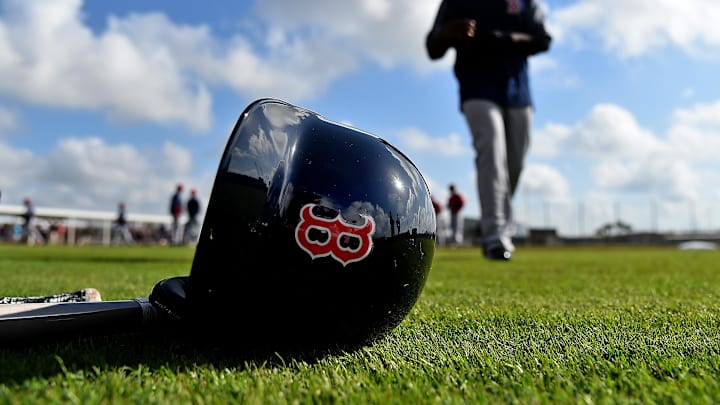Feb 18, 2019; Lee County, FL, USA; A general view of a Boston Red Sox helmet as Boston Red Sox center fielder Jackie Bradley Jr. (19) walks on the field during a spring training workout at Jet Blue Park at Fenway South. Mandatory Credit: Jasen Vinlove-Imagn Images