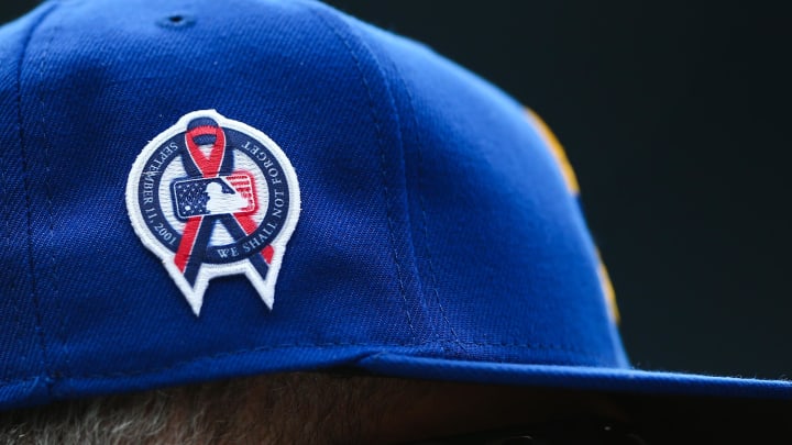 Sep 11, 2022; Seattle, Washington, USA;  A patch remembering the September 11th terrorist attacks is seen on a Seattle Mariners hat during the game against the Atlanta Braves at T-Mobile Park. Mandatory Credit: Lindsey Wasson-USA TODAY Sports