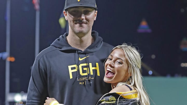 Pittsburgh Pirates starting pitcher Paul Skenes (30) poses with his girlfriend Louisiana State University gymnast girlfriend Livvy Dunne.