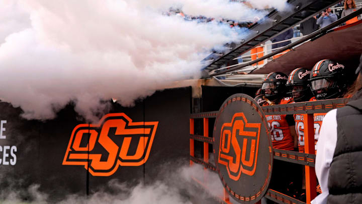 Oklahoma State waits to run on to the field before the college football game between the Oklahoma State Cowboys and the Iowa State Cyclones at Boone Pickens Stadium in Stillwater, Okla., Saturday Nov. 29, 2025. Oklahoma State waits to run on to the field before the college football game between the Oklahoma State Cowboys and the Iowa State Cyclones at Boone Pickens Stadium in Stillwater, Okla., Saturday Nov. 29, 2025.