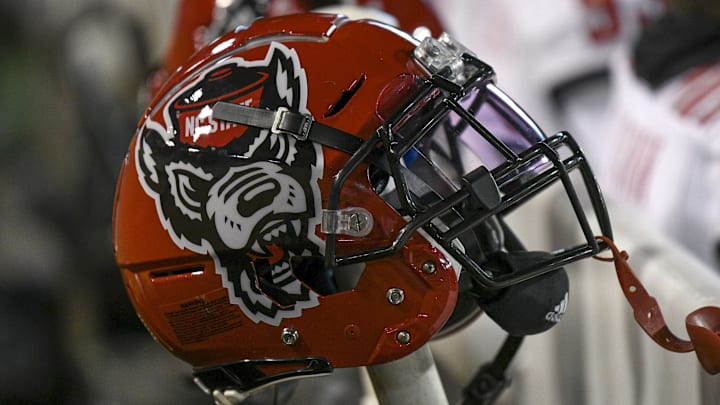 Nov 13, 2021; Winston-Salem, North Carolina, USA; A North Carolina State Wolfpack helmet seen on the sideline during the second half against the Wake Forest Demon Deacons at Truist Field. Mandatory Credit: William Howard-Imagn Images