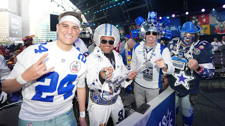 Dallas Cowboys fans pose for a photograph during the NFL Draft at Campus Martius Park and Hart Plaza. 