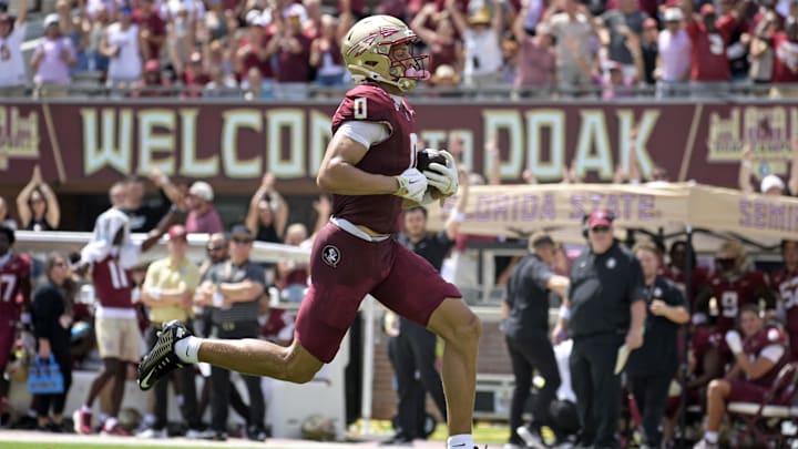 Sep 6, 2025; Tallahassee, Florida, USA; Florida State Seminoles wide receiver Duce Robinson (0) catches a touchdown during the first half against the East Texas A&M at Doak S. Campbell Stadium. Mandatory Credit: Melina Myers-Imagn Images