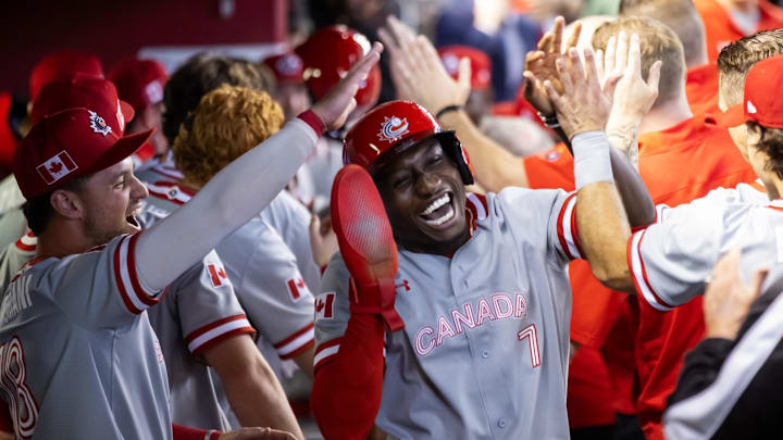 Mar 14, 2023; Phoenix, Arizona, USA; Canada outfielder Dasan Brown celebrates with teammates after scoring against Colombia during the World Baseball Classic at Chase Field. Mandatory Credit: Mark J. Rebilas-USA TODAY Sports