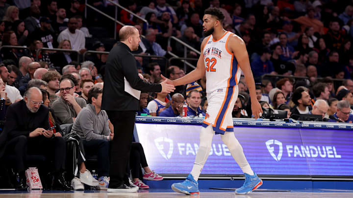 Jan 10, 2025; New York, New York, USA; New York Knicks center Karl-Anthony Towns (32) shakes hands with New York Knicks head coach Tom Thibodeau as he exits the game during the third quarter against the Oklahoma City Thunder at Madison Square Garden. Mandatory Credit: Brad Penner-Imagn Images