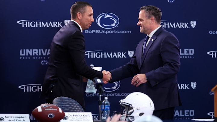Matt Campbell, left, shakes hands with Penn State Athletic Director Pat Kraft while being announced as the Penn State Nittany Lions new head coach during a press conference at Beaver Stadium. Matt Campbell, left, shakes hands with Penn State Athletic Director Pat Kraft while being announced as the Penn State Nittany Lions new head coach during a press conference at Beaver Stadium.