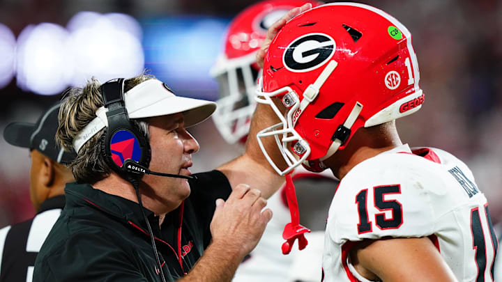 Sep 28, 2024; Tuscaloosa, Alabama, USA; Georgia Bulldogs head coach Kirby Smart talks with quarterback Carson Beck (15) during the first half against the Alabama Crimson Tide at Bryant-Denny Stadium. Mandatory Credit: John David Mercer-Imagn Images Sep 28, 2024; Tuscaloosa, Alabama, USA; Georgia Bulldogs head coach Kirby Smart talks with quarterback Carson Beck (15) during the first half against the Alabama Crimson Tide at Bryant-Denny Stadium. Mandatory Credit: John David Mercer-Imagn Images