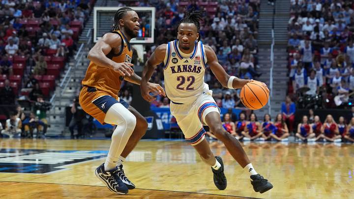 Mar 20, 2026; San Diego, CA, USA; Kansas Jayhawks guard Darryn Peterson (22) controls the ball against California Baptist Lancers guard Martel Williams (33) in the first half during a first round game of the men's 2026 NCAA Tournament at Viejas Arena. Mandatory Credit: Kirby Lee-Imagn Images Mar 20, 2026; San Diego, CA, USA; Kansas Jayhawks guard Darryn Peterson (22) controls the ball against California Baptist Lancers guard Martel Williams (33) in the first half during a first round game of the men's 2026 NCAA Tournament at Viejas Arena. Mandatory Credit: Kirby Lee-Imagn Images