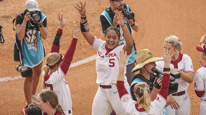 Oklahoma players react after a walk off win against Arkansas at Jack Turner Softball Stadium.