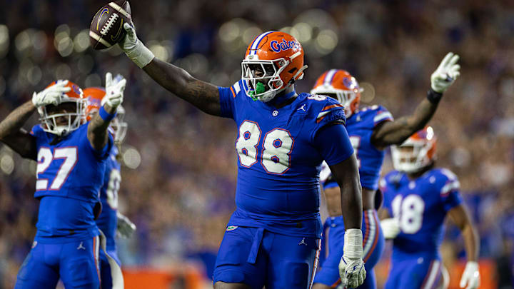Nov 16, 2024; Gainesville, Florida, USA; Florida Gators defensive lineman Caleb Banks (88) celebrates with the ball after a fumble recovery against the LSU Tigers during the second half at Ben Hill Griffin Stadium. Mandatory Credit: Matt Pendleton-Imagn Images Nov 16, 2024; Gainesville, Florida, USA; Florida Gators defensive lineman Caleb Banks (88) celebrates with the ball after a fumble recovery against the LSU Tigers during the second half at Ben Hill Griffin Stadium. Mandatory Credit: Matt Pendleton-Imagn Images