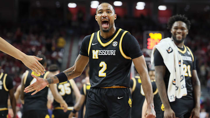 Feb 22, 2025; Fayetteville, Arkansas, USA; Missouri Tigers guard Tamar Bates (2) celebrates at the end of the first half against the Arkansas Razorbacks at Bud Walton Arena. Mandatory Credit: Nelson Chenault-Imagn Images