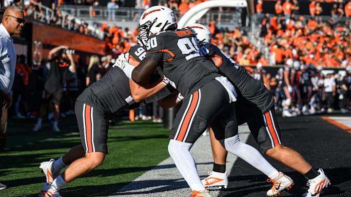 Sep 21, 2024; Corvallis, Oregon, USA; Oregon State Beavers defensive lineman Jojo Johnson (90) and defensive lineman Luke Levengood (96) in pregame warmups before the game against the Purdue Boilermakers at Reser Stadium. Mandatory Credit: Craig Strobeck-Imagn Images