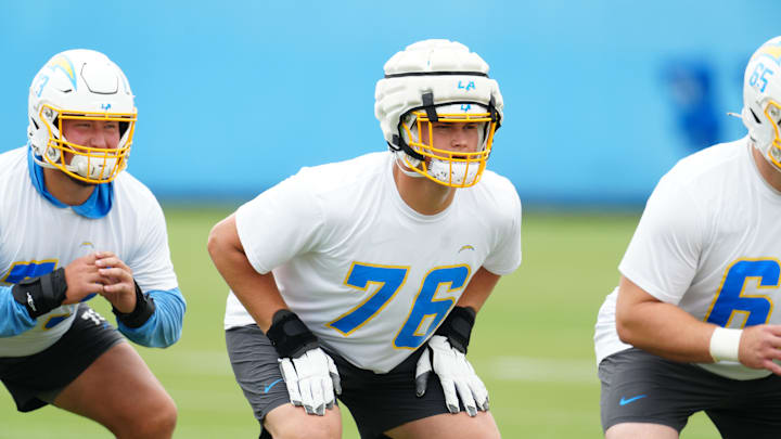 Los Angeles Chargers tackle Joe Alt (76) wears a Guardian helmet cap during organized team activities at the Hoag Performance Center. Mandatory Credit: Kirby Lee-USA TODAY Sports