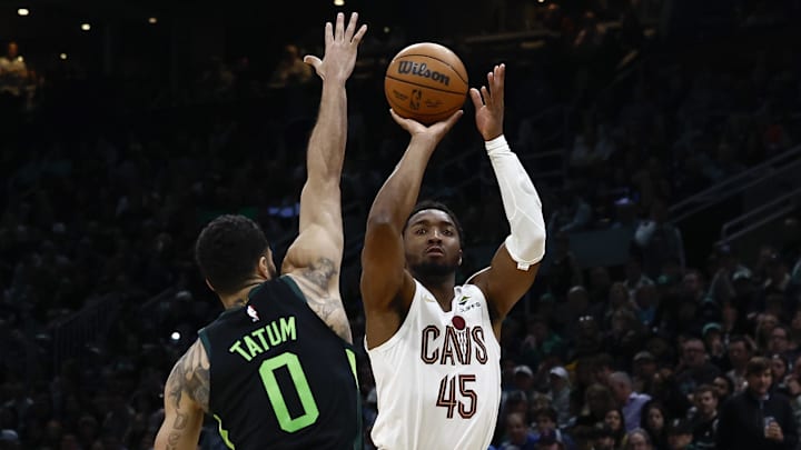 Feb 28, 2025; Boston, Massachusetts, USA; Cleveland Cavaliers guard Donovan Mitchell (45) shoots over Boston Celtics forward Jayson Tatum (0) during the second half at TD Garden. Mandatory Credit: Winslow Townson-Imagn Images
