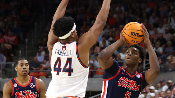 Feb 26, 2025; Auburn, Alabama, USA;  Auburn Tigers center Dylan Cardwell (44) tries to block the shot of Mississippi Rebels forward Malik Dia (0) during the first half at Neville Arena. Mandatory Credit: John Reed-Imagn Images