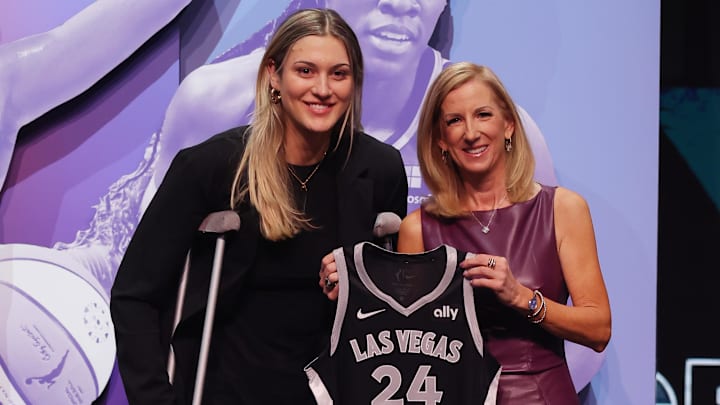 Apr 15, 2024; Brooklyn, NY, USA; Elizabeth Kitley poses with WNBA commissioner Cathy Engelbert after being selected with the number twenty-four overall pick to the Las Vegas Aces in the 2024 WNBA Draft at Brooklyn Academy of Music. Mandatory Credit: Brad Penner-Imagn Images Apr 15, 2024; Brooklyn, NY, USA; Elizabeth Kitley poses with WNBA commissioner Cathy Engelbert after being selected with the number twenty-four overall pick to the Las Vegas Aces in the 2024 WNBA Draft at Brooklyn Academy of Music. Mandatory Credit: Brad Penner-Imagn Images