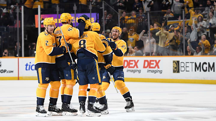 Mar 2, 2024; Nashville, Tennessee, USA; Nashville Predators players celebrate with center Cody Glass