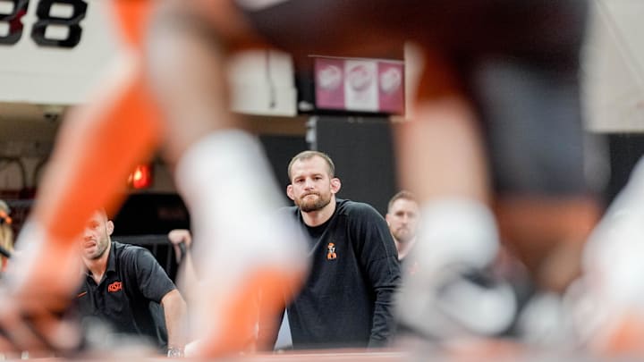 Oklahoma State’s head coach David Taylor stands on the side of the mat during an NCAA wrestling meet between Oklahoma State and Missouri at Gallagher-Iba Arena in Stillwater, Okla., on Sunday, Feb. 2, 2025.