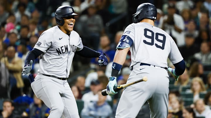 Sep 17, 2024; Seattle, Washington, USA; New York Yankees right fielder Juan Soto (22) celebrates a two-run home run against the Seattle Mariners with designated hitter Aaron Judge (99) during the fourth inning at T-Mobile Park. Mandatory Credit: Joe Nicholson-Imagn Images