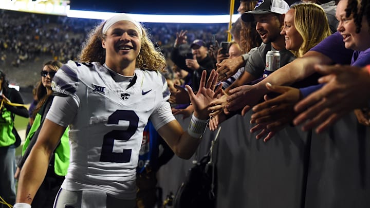 Oct 12, 2024; Boulder, Colorado, USA; Kansas State Wildcats quarterback Avery Johnson (2) celebrates with fans after a win against the Colorado Buffaloes at Folsom Field. Oct 12, 2024; Boulder, Colorado, USA; Kansas State Wildcats quarterback Avery Johnson (2) celebrates with fans after a win against the Colorado Buffaloes at Folsom Field.