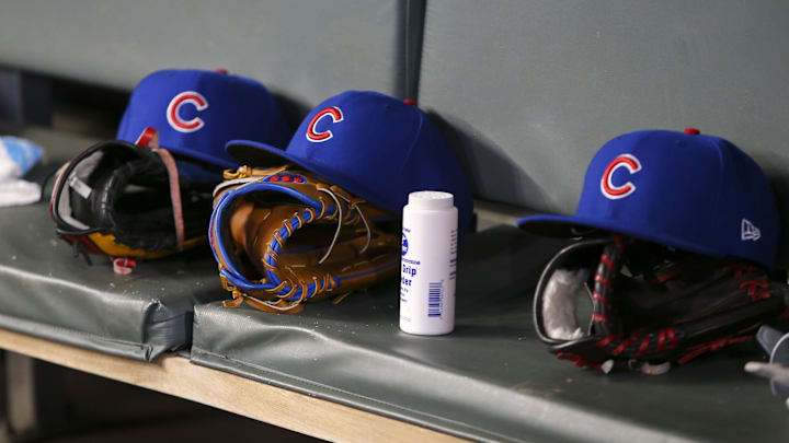 Apr 3, 2019; Atlanta, GA, USA; Detailed view of Chicago Cubs hats and gloves in the dugout against the Atlanta Braves in the fifth inning at SunTrust Park. Apr 3, 2019; Atlanta, GA, USA; Detailed view of Chicago Cubs hats and gloves in the dugout against the Atlanta Braves in the fifth inning at SunTrust Park.