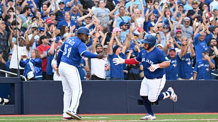 Sep 28, 2025; Toronto, Ontario, CAN; Toronto Blue Jays catcher Alejandro Kirk (30) is congratulated by third base coach Carlos Febles (51) after hitting a two-run home run against the Tampa Bay Rays in the fifth inning at Rogers Centre. Mandatory Credit: Dan Hamilton-Imagn Images Sep 28, 2025; Toronto, Ontario, CAN; Toronto Blue Jays catcher Alejandro Kirk (30) is congratulated by third base coach Carlos Febles (51) after hitting a two-run home run against the Tampa Bay Rays in the fifth inning at Rogers Centre. Mandatory Credit: Dan Hamilton-Imagn Images