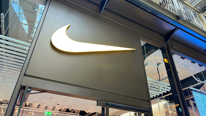 Nike Store Sign on Building Exterior, Store Frontage