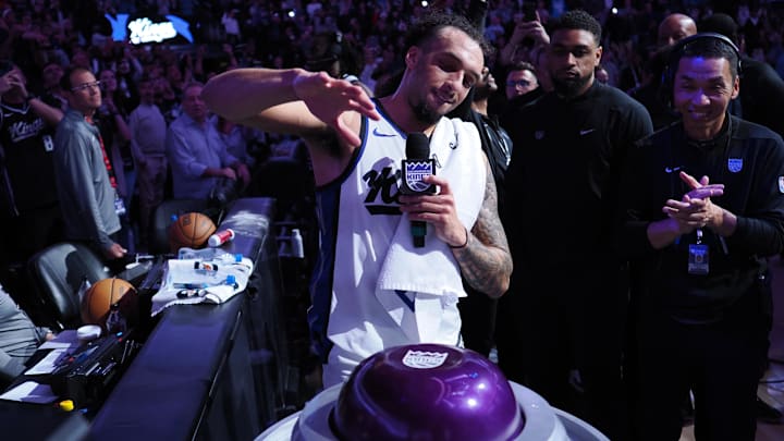 Mar 19, 2025; Sacramento, California, USA; Sacramento Kings guard Devin Carter (22) lights the beam after a win against the Cleveland Cavaliers at Golden 1 Center. Mandatory Credit: Kelley L Cox-Imagn Images