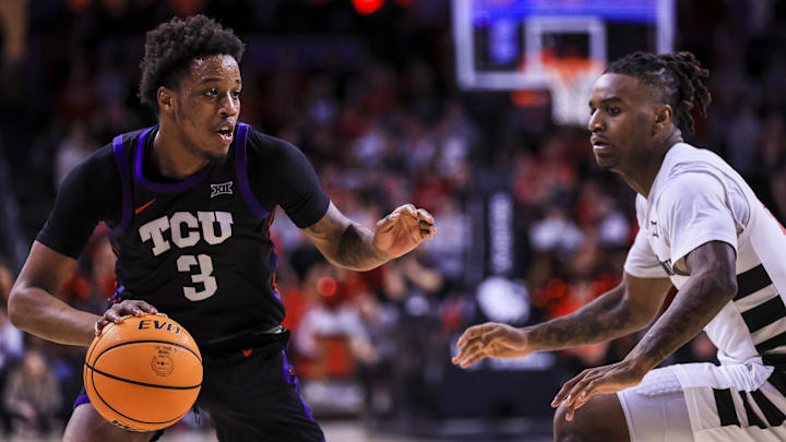 Feb 22, 2025; Cincinnati, Ohio, USA; TCU Horned Frogs guard Vasean Allette (3) dribbles against Cincinnati Bearcats guard Jizzle James (2) in the second half at Fifth Third Arena. Mandatory Credit: Katie Stratman-Imagn Images