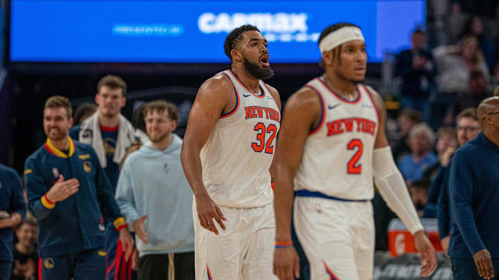 Mar 15, 2025; San Francisco, California, USA; New York Knicks center Karl-Anthony Towns (32) reacts after being called for a foul against the Golden State Warriors during the fourth quarter at Chase Center. Mandatory Credit: Neville E. Guard-Imagn Images