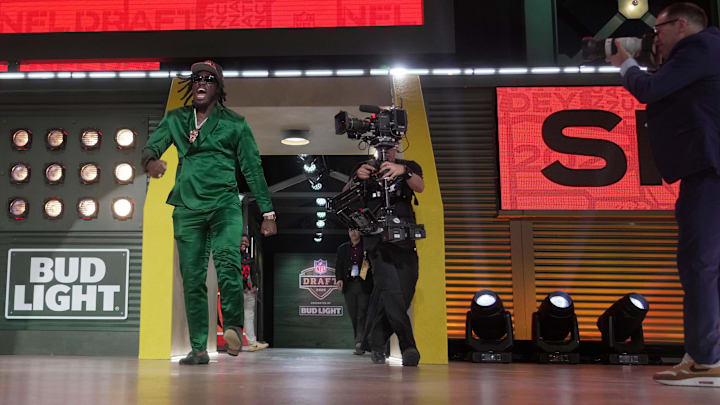 Texas A&M Aggies defensive end Shemar Stewart poses enters the stage after being selected by the Cincinnati Bengals as the number seventeen pick in the first round of the 2025 NFL Draft at Lambeau Field.