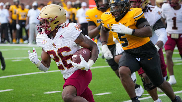 Sep 14, 2024; Columbia, Missouri, USA; Boston College Eagles running back Datrell Jones (26) runs the ball as Missouri Tigers defensive tackle Kristian Williams (5) chases during the first half at Faurot Field at Memorial Stadium. Mandatory Credit: Denny Medley-Imagn Images Sep 14, 2024; Columbia, Missouri, USA; Boston College Eagles running back Datrell Jones (26) runs the ball as Missouri Tigers defensive tackle Kristian Williams (5) chases during the first half at Faurot Field at Memorial Stadium. Mandatory Credit: Denny Medley-Imagn Images