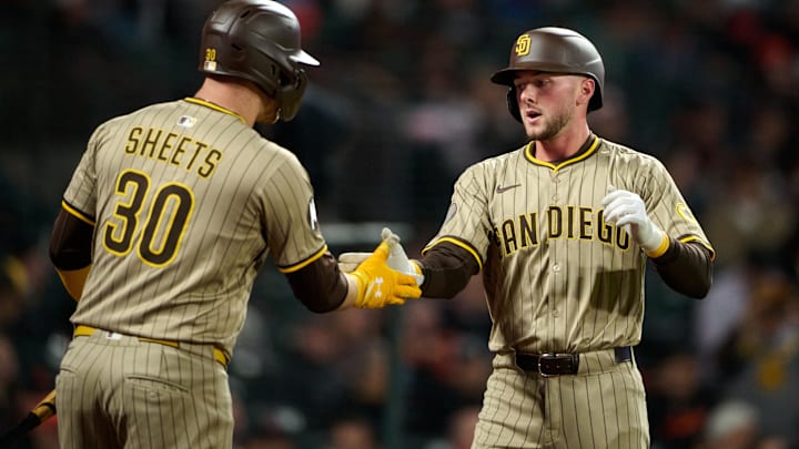 Aug 12, 2025; San Francisco, California, USA; San Diego Padres outfielder Jackson Merrill (3) shakes hands with outfielder Gavin Sheets (30) after hitting a one run home run against the San Francisco Giants during the eighth inning at Oracle Park. Mandatory Credit: Robert Edwards-Imagn Images