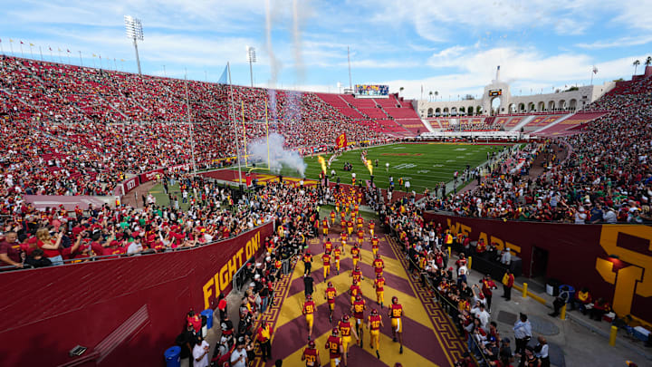 Nov 30, 2024; Los Angeles, California, USA; A general overall view as Southern California Trojans players enter the field before the game against the Notre Dame Fighting Irish at United Airlines Field at Los Angeles Memorial Coliseum. Mandatory Credit: Kirby Lee-Imagn Images