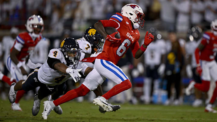 Aug 30, 2025; Dallas, Texas, USA; Southern Methodist Mustangs running back Chris Johnson Jr. (6) runs with the ball during the game between the Southern Methodist Mustangs and the East Texas A&M Lions at Gerald J. Ford Stadium. Mandatory Credit: Jerome Miron-Imagn Images