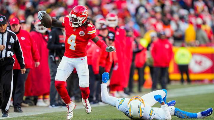 Dec 14, 2025; Kansas City, Missouri, USA; Kansas City Chiefs wide receiver Rashee Rice (4) runs with the ball against Los Angeles Chargers cornerback Benjamin St-Juste (24) during the first half at GEHA Field at Arrowhead Stadium. Mandatory Credit: Jay Biggerstaff-Imagn Images Dec 14, 2025; Kansas City, Missouri, USA; Kansas City Chiefs wide receiver Rashee Rice (4) runs with the ball against Los Angeles Chargers cornerback Benjamin St-Juste (24) during the first half at GEHA Field at Arrowhead Stadium. Mandatory Credit: Jay Biggerstaff-Imagn Images