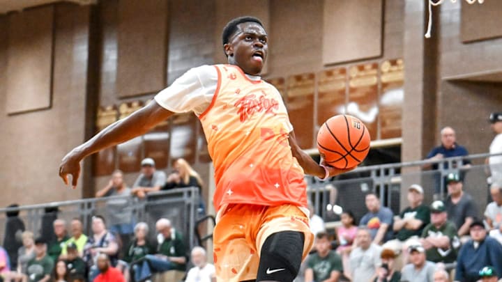 Michigan State and Team Faygo's Coen Carr dunks against Team Snipes in the game on Tuesday, June 25, 2024, during the Moneyball Pro-Am at Holt High School.