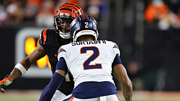 CINCINNATI, OH - DECEMBER 28 - Denver Broncos cornerback Pat Surtain II (2) covers Cincinnati Bengals wide receiver Ja'Marr Chase (1) in a game between the Denver Broncos and the Cincinnati Bengals at Paycor Stadium on Saturday, December 28, 2024. CINCINNATI, OH - DECEMBER 28 - Denver Broncos cornerback Pat Surtain II (2) covers Cincinnati Bengals wide receiver Ja'Marr Chase (1) in a game between the Denver Broncos and the Cincinnati Bengals at Paycor Stadium on Saturday, December 28, 2024.
